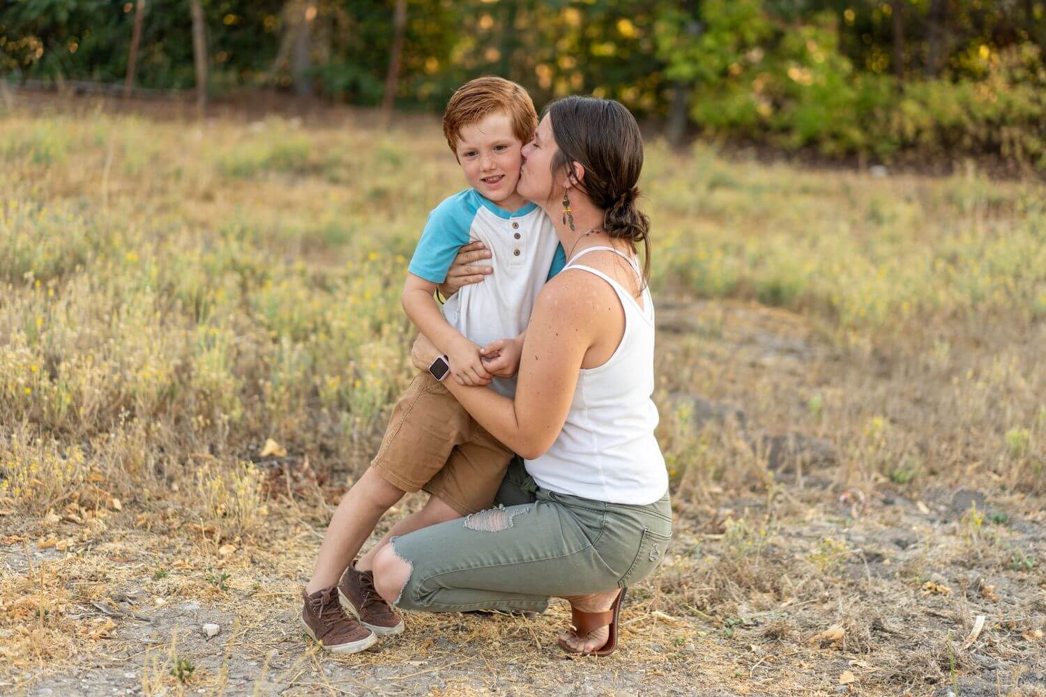 3-mother-kissing-son-in-nature-scene.jpg
