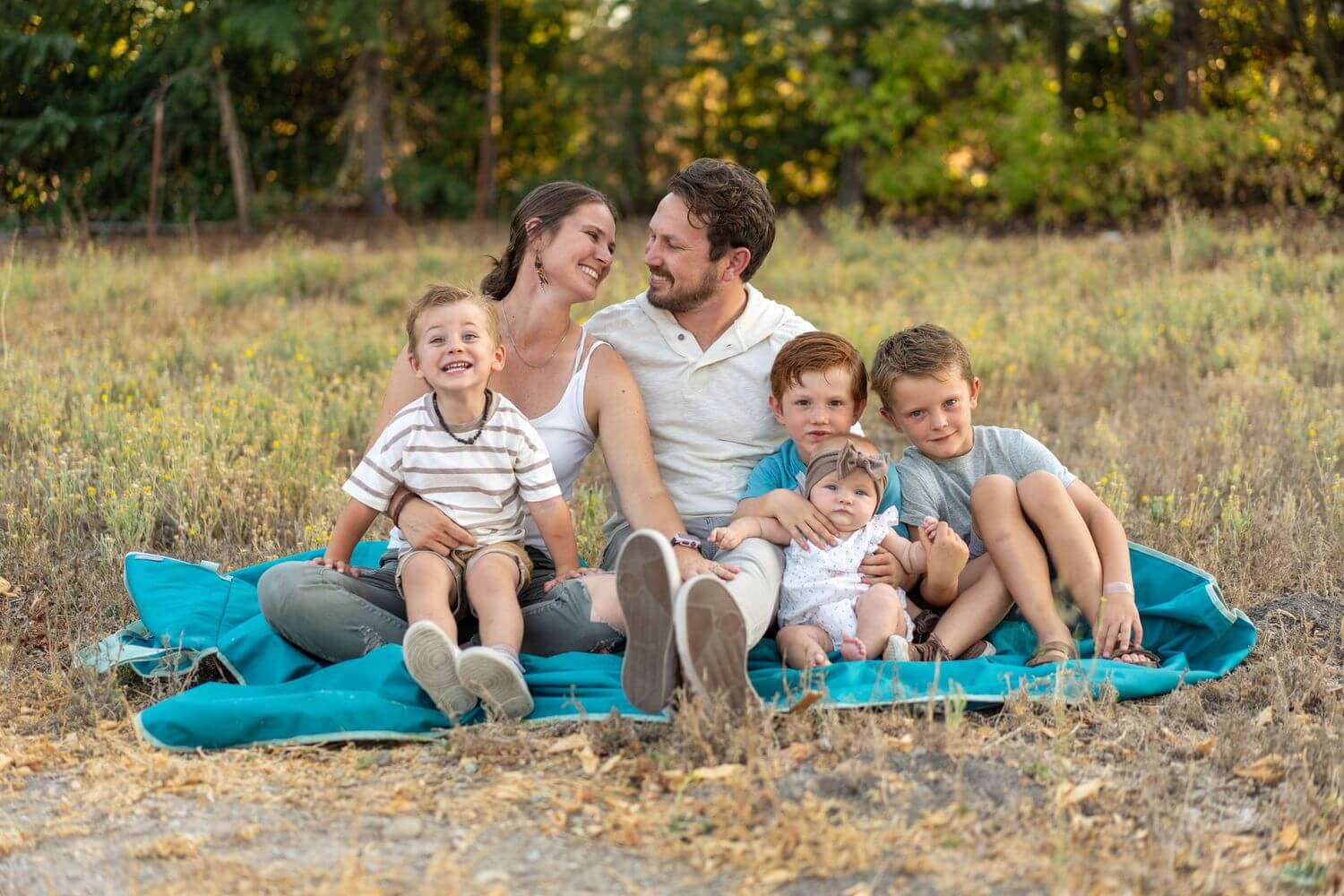 1-happy-family-picnic-outdoors-nature-scene.jpg