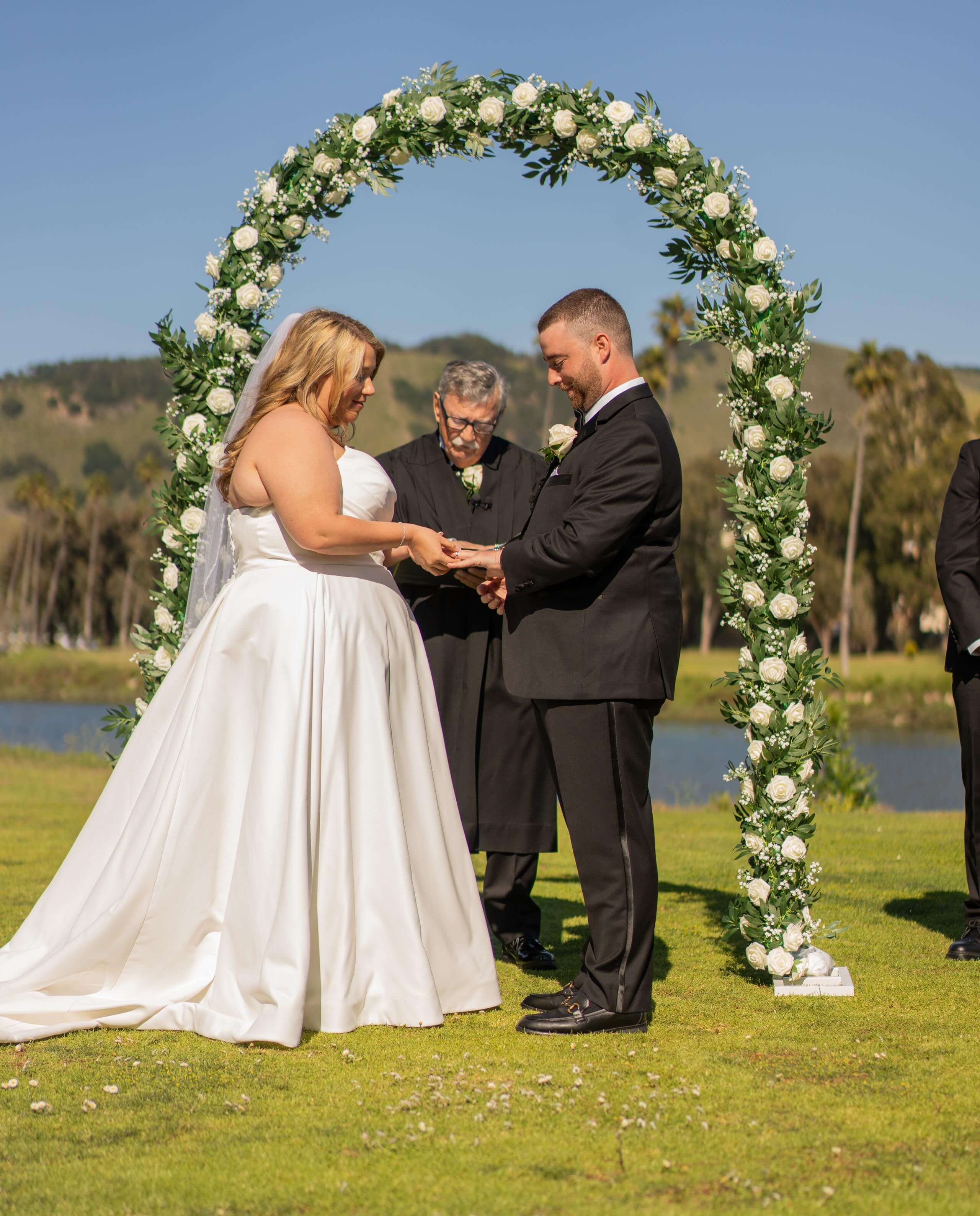 timeless-images-california-wedding-vows-under-floral-arch.jpg