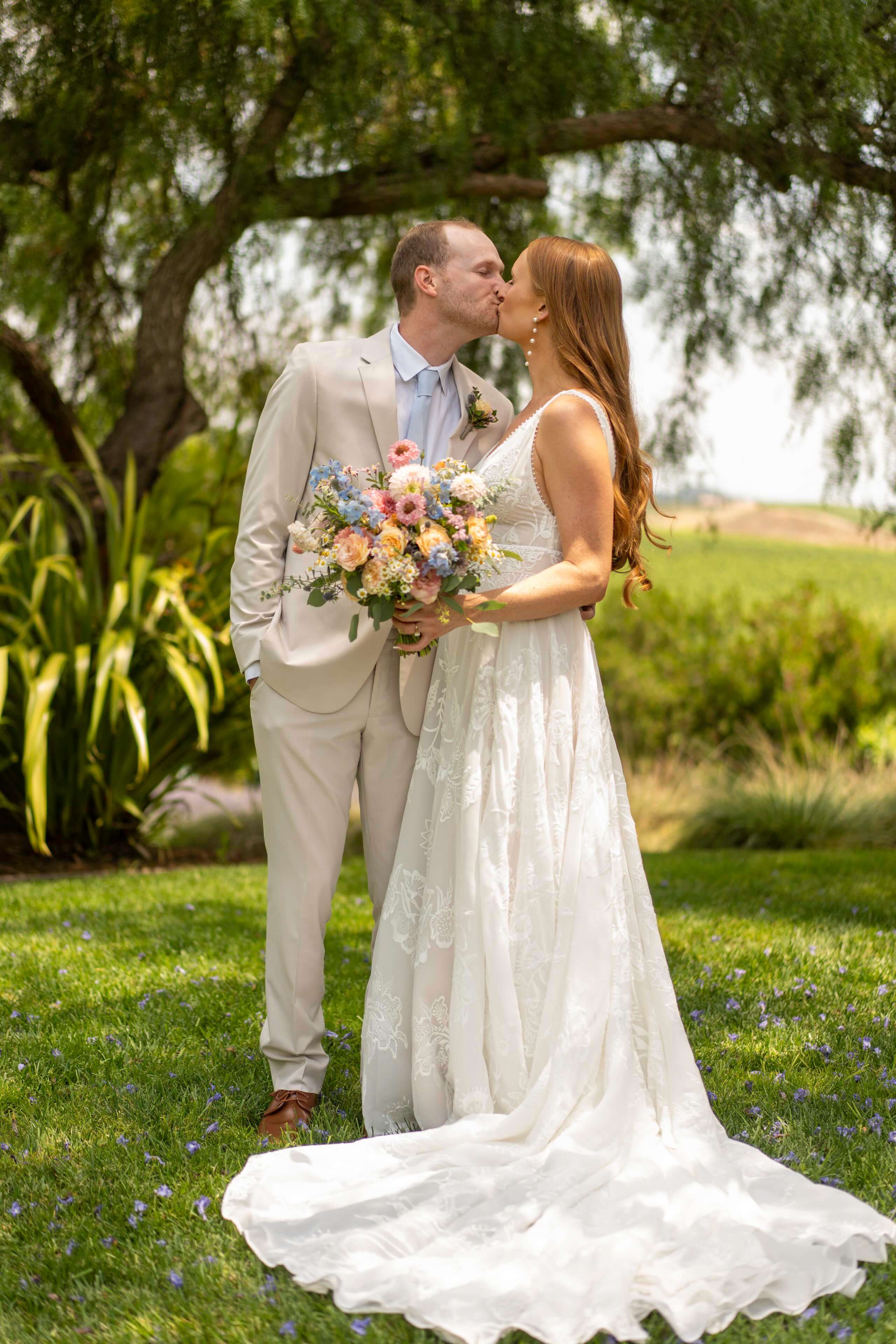 wedding-couple-kissing-outdoor-...tral-coast-timeless-images.jpg